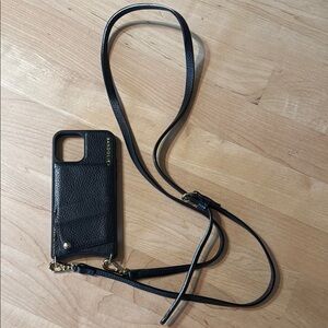 Bandolier Black Leather Phone Case with Strap for iPhone 13 Pro.
